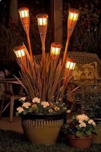 So many awesome garden ideas - I love these lights made from tiki torches!